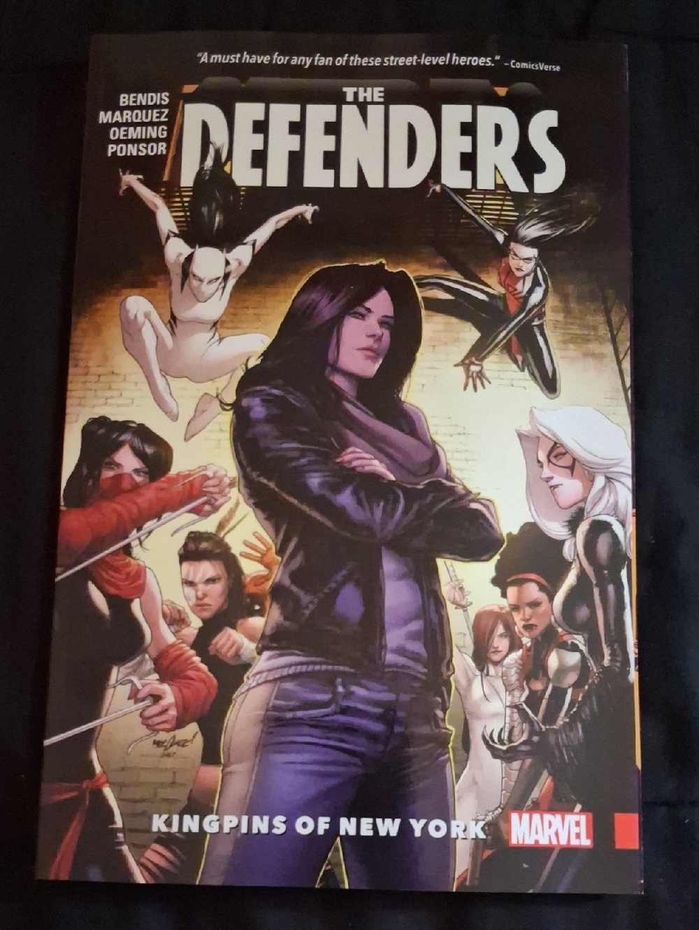 Marvel The Defenders Trade Paperback – Black & Purple Jacket Cover
